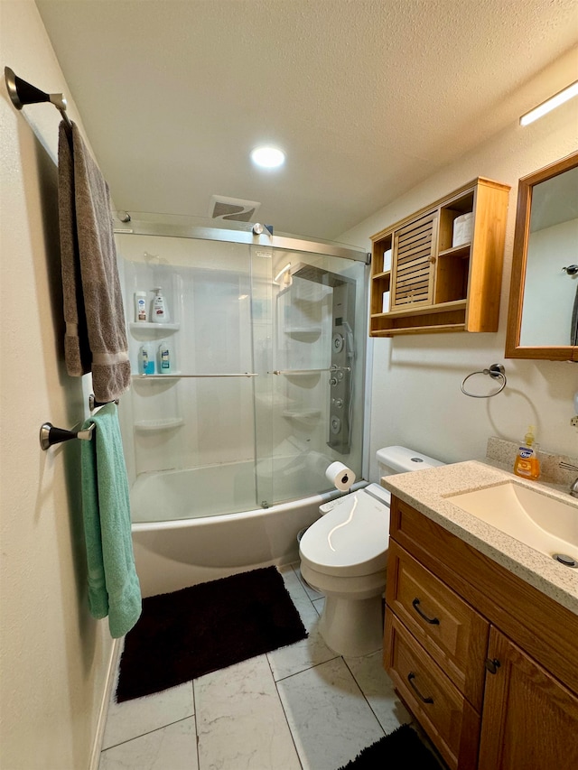 full bathroom with a textured ceiling, combined bath / shower with glass door, vanity, and toilet