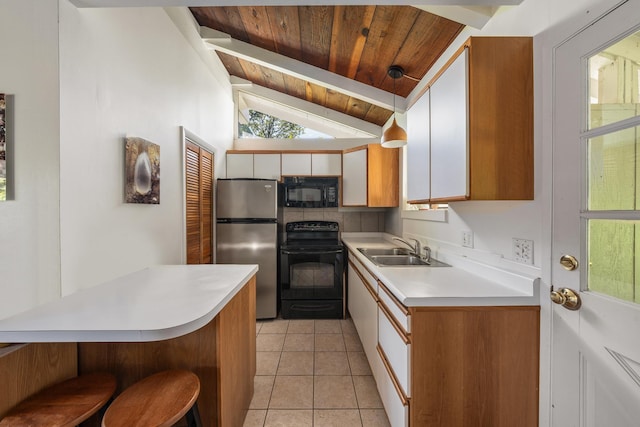 kitchen with sink, wooden ceiling, vaulted ceiling, light tile patterned floors, and black appliances