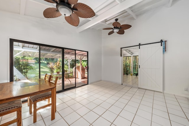 tiled empty room featuring beamed ceiling, a towering ceiling, a barn door, and ceiling fan