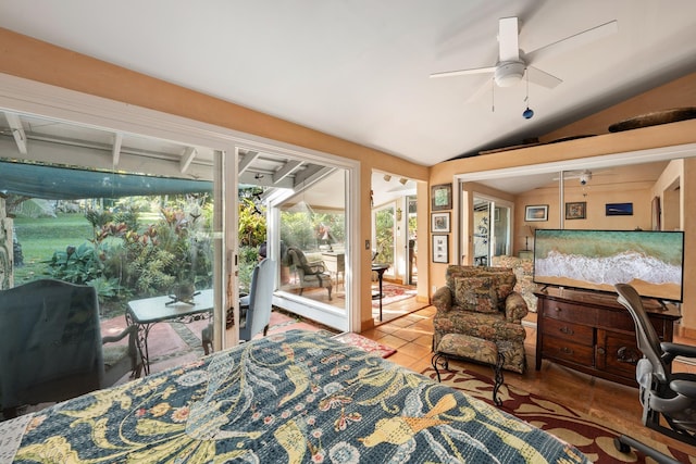 bedroom with tile patterned floors, access to outside, vaulted ceiling, and ceiling fan