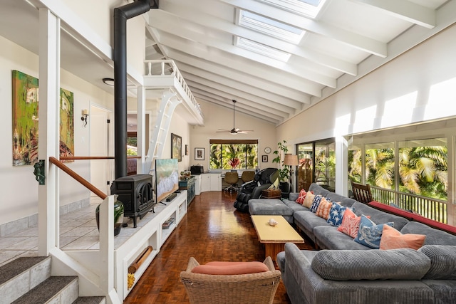 sunroom featuring ceiling fan and lofted ceiling with skylight