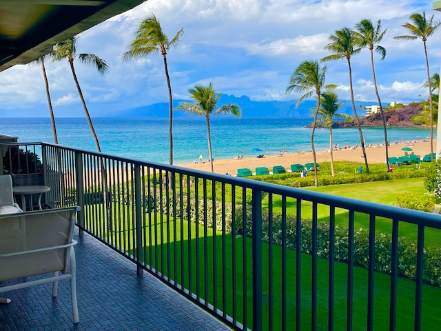 balcony featuring a water view