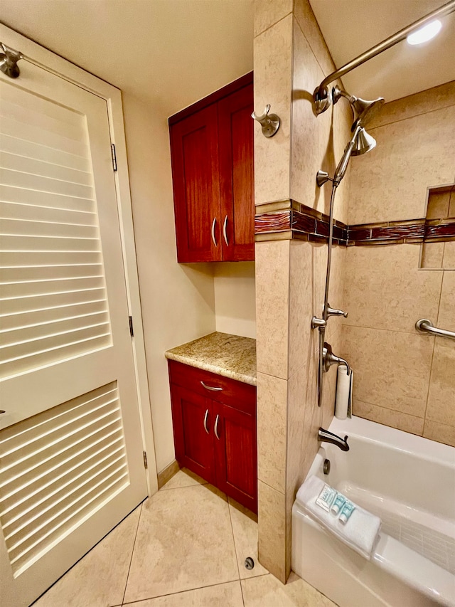 bathroom with tiled shower / bath and tile flooring