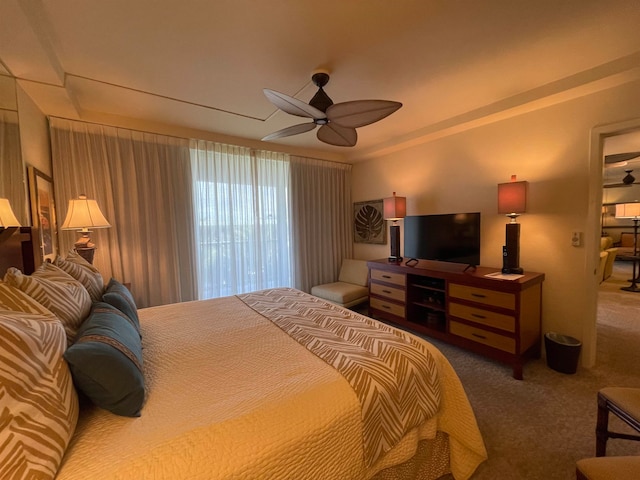 bedroom featuring dark carpet and ceiling fan