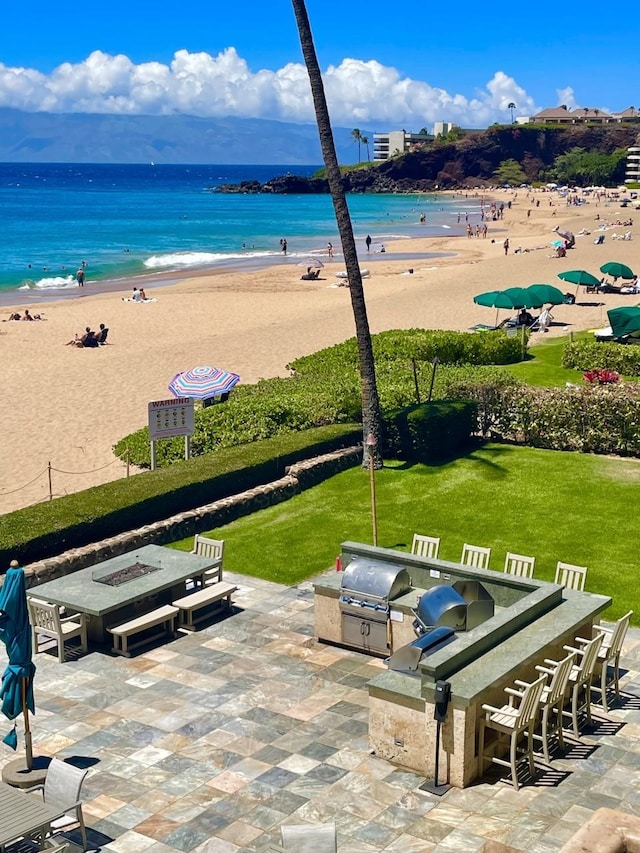 exterior space with a beach view and a water view