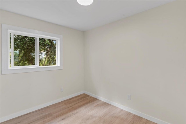 unfurnished room with light hardwood / wood-style floors