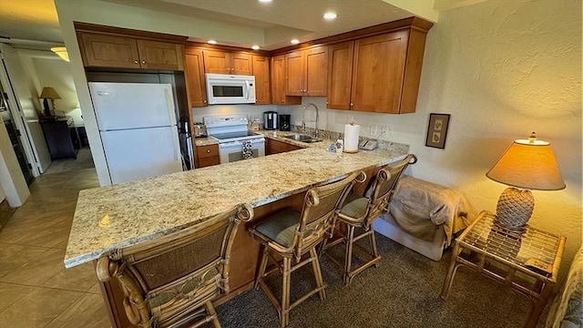 kitchen featuring floor to ceiling windows, ceiling fan, and decorative light fixtures