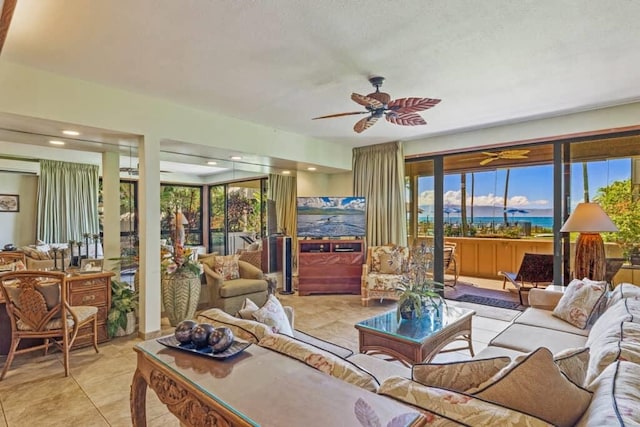 tiled living room with ceiling fan