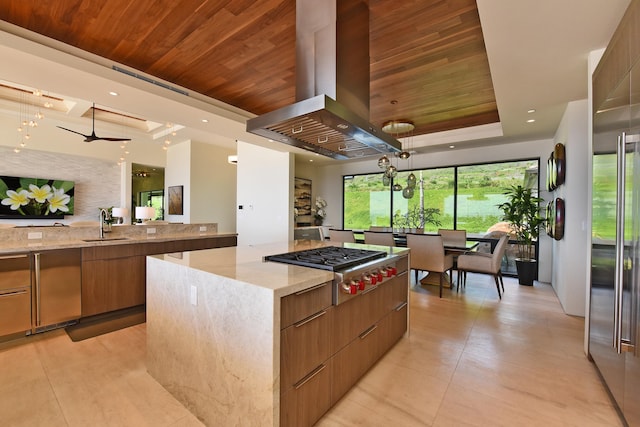 kitchen with wood ceiling, stainless steel gas cooktop, island range hood, and a spacious island