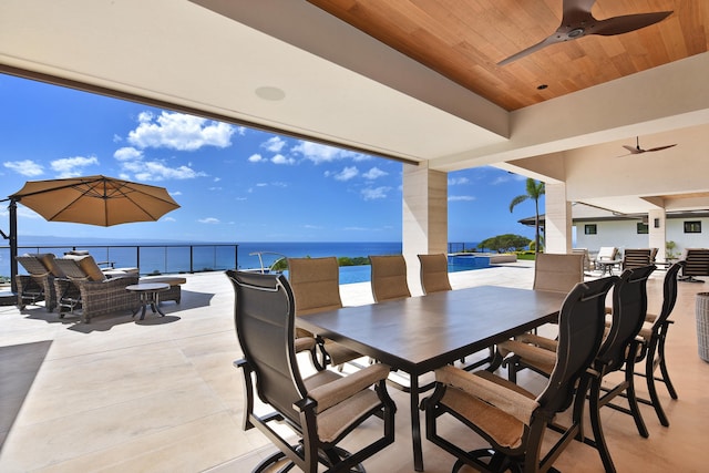 view of patio featuring an outdoor hangout area, a water view, and ceiling fan