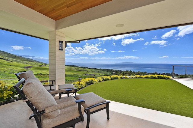 view of patio with a water view