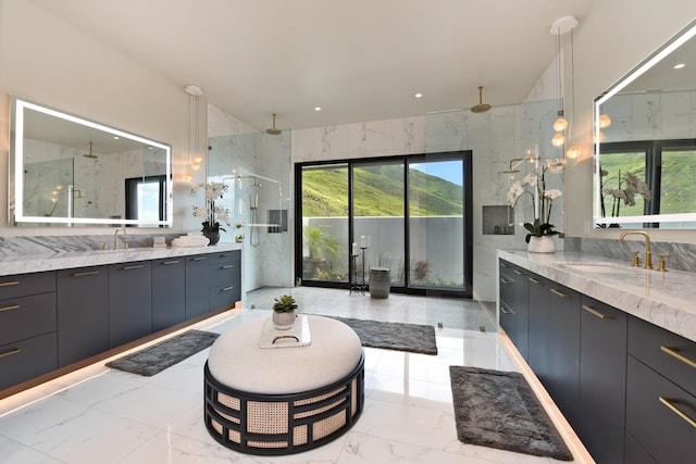 bathroom with vanity and tiled shower