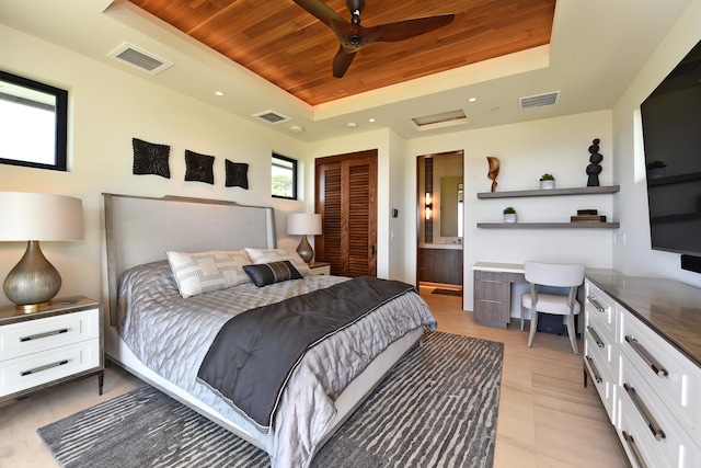 bedroom with connected bathroom, ceiling fan, a raised ceiling, and wooden ceiling