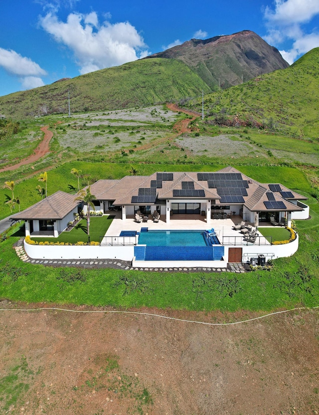 view of pool featuring a mountain view and a patio area