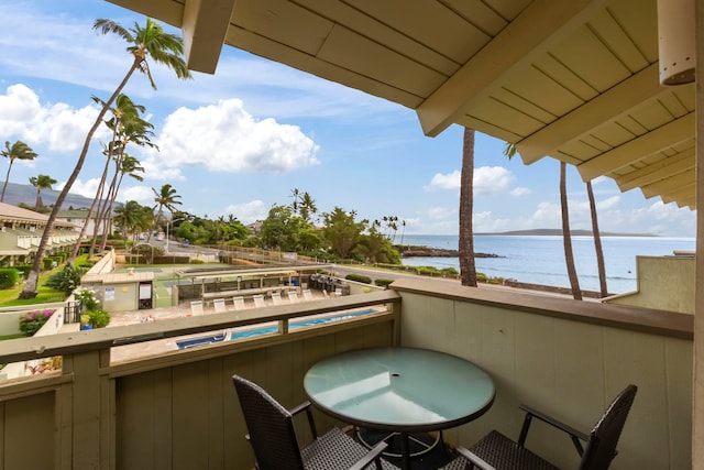 balcony featuring a water view