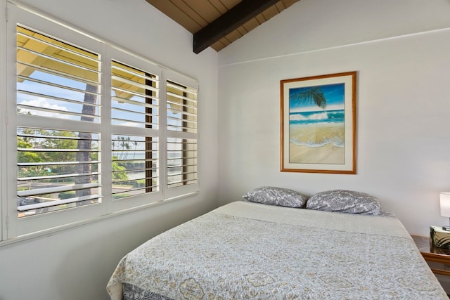 bedroom featuring wooden ceiling and lofted ceiling with beams