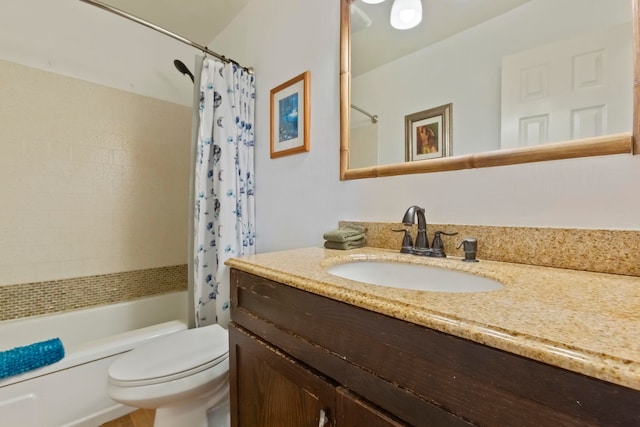 full bathroom featuring shower / bath combo with shower curtain, vanity, and toilet