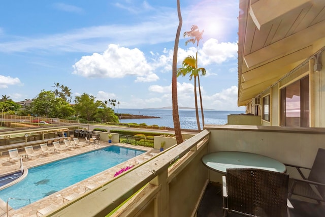 view of pool with a water view