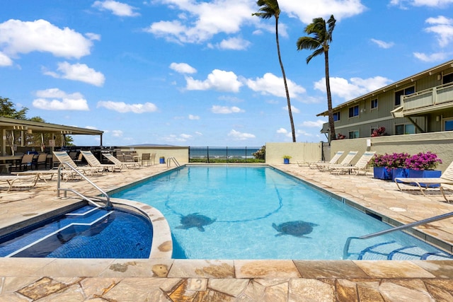 view of swimming pool featuring a patio area