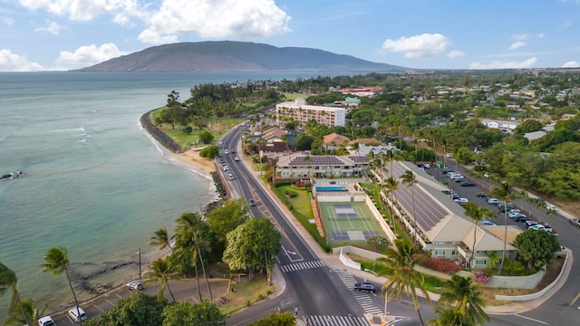 aerial view featuring a water and mountain view