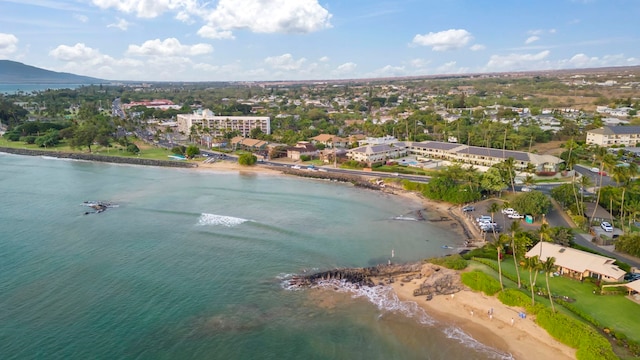 bird's eye view featuring a view of the beach and a water view