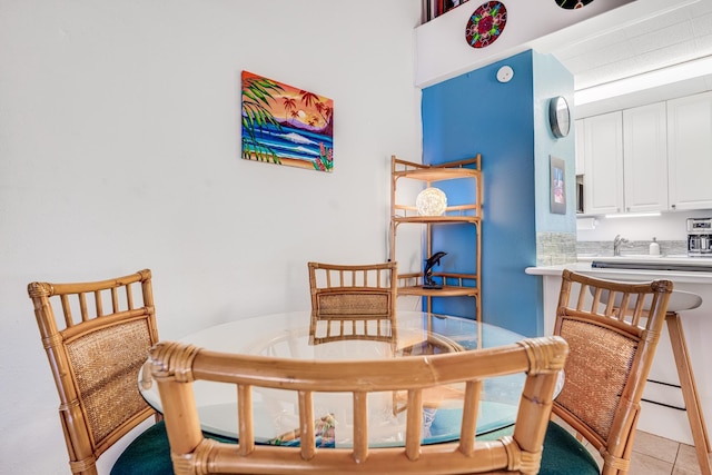 dining space with light tile patterned floors