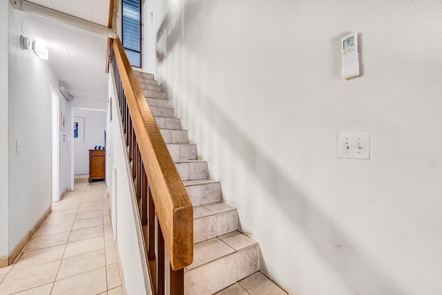 stairs featuring tile patterned flooring