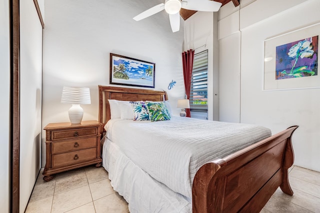 bedroom featuring light tile patterned floors and ceiling fan
