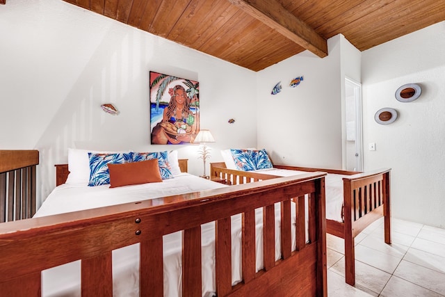bedroom with wooden ceiling, beamed ceiling, and light tile patterned floors