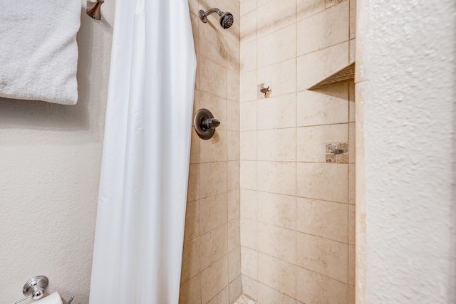 bathroom with a shower stall