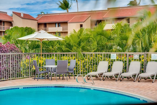 community pool with a patio