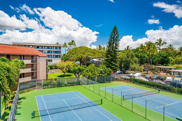 view of tennis court with fence