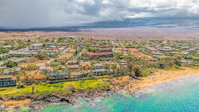 drone / aerial view with a water view and a view of the beach