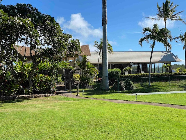 view of home's community featuring a lawn