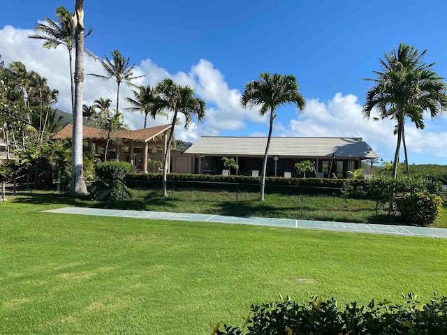 view of home's community featuring a yard