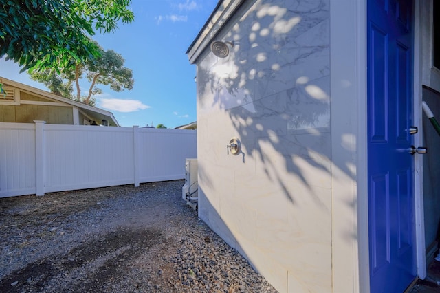 view of home's exterior featuring fence