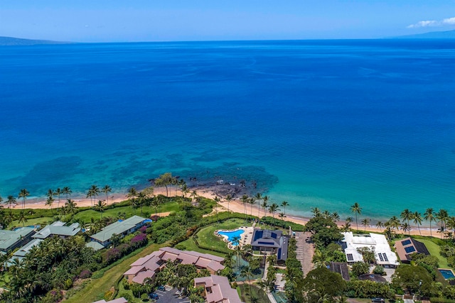 birds eye view of property with a beach view and a water view