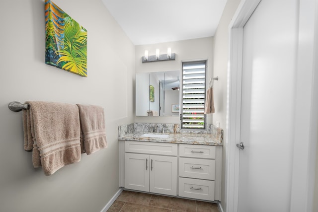 bathroom featuring tile patterned flooring and vanity