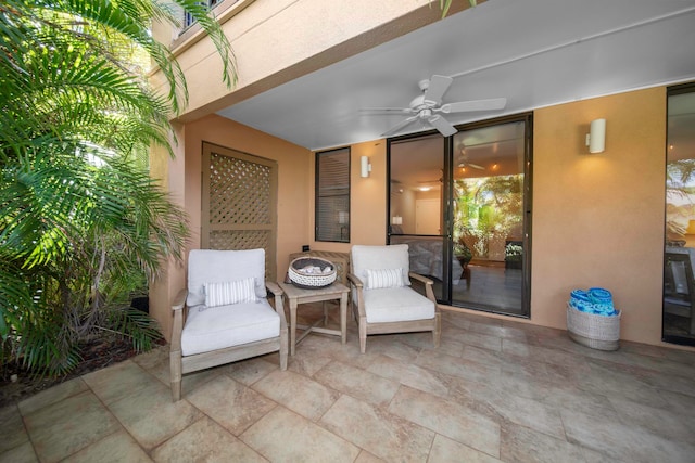 view of patio / terrace featuring ceiling fan