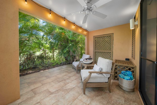 view of patio featuring ceiling fan