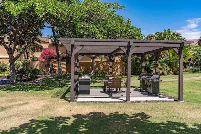 view of community with a lawn and a pergola