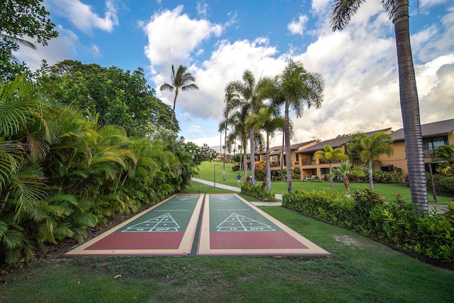 view of home's community featuring a lawn