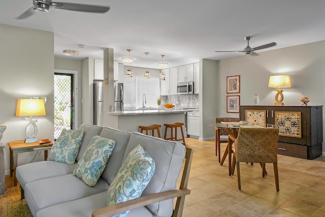 living room with ceiling fan