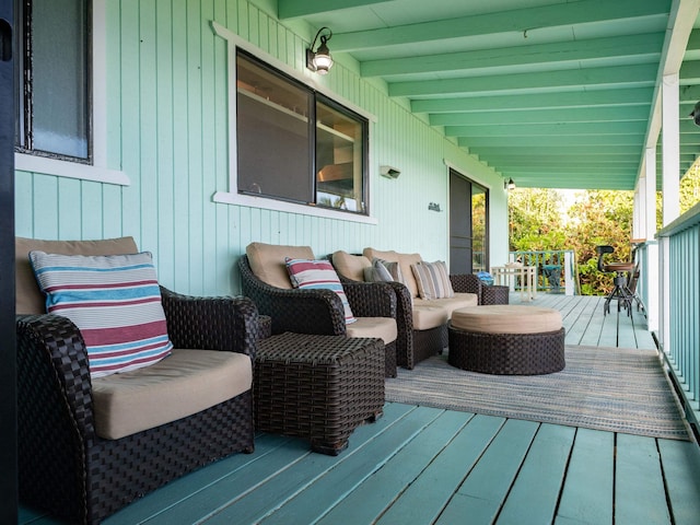 wooden deck with an outdoor hangout area