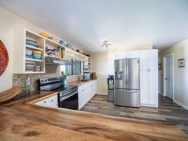 kitchen with white cabinets, extractor fan, dark hardwood / wood-style floors, and appliances with stainless steel finishes