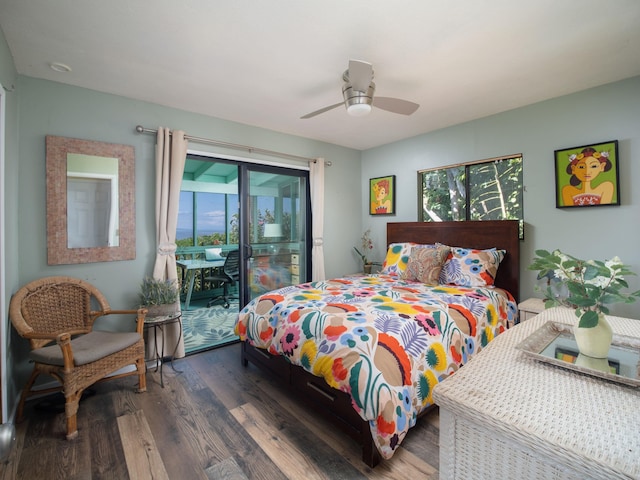 bedroom with access to exterior, multiple windows, dark hardwood / wood-style floors, and ceiling fan