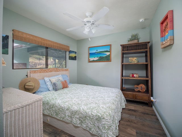 bedroom featuring ceiling fan and dark hardwood / wood-style floors