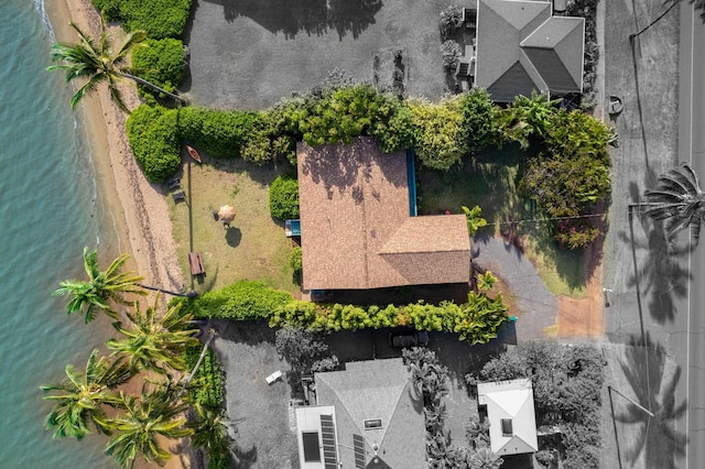 bird's eye view featuring a water view and a beach view