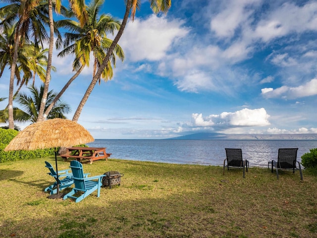 water view featuring an outdoor fire pit