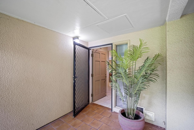 hallway featuring light tile patterned flooring